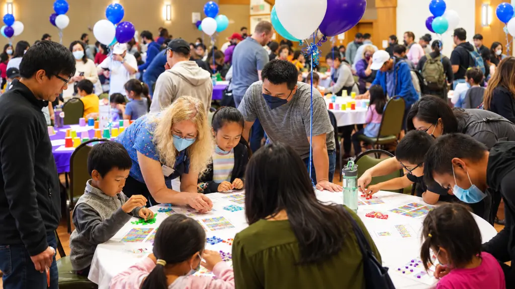 Families working on puzzles at a Julia Robinson Mathematics Festival